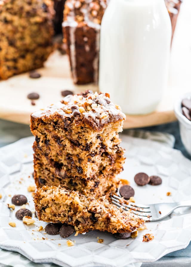 This Banana Chocolate Chip Coffee Cake recipe is a tasty new take on your regular banana bread. Loaded with walnuts and chocolate chips and a brown sugar cinnamon filling, this coffee cake won't let you down!