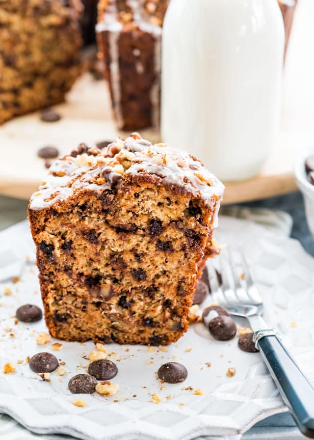 a slice of coffee cake with chocolate chips and a fork