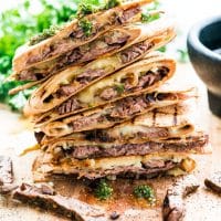 side view shot of a stack of chimichurri steak quesadillas