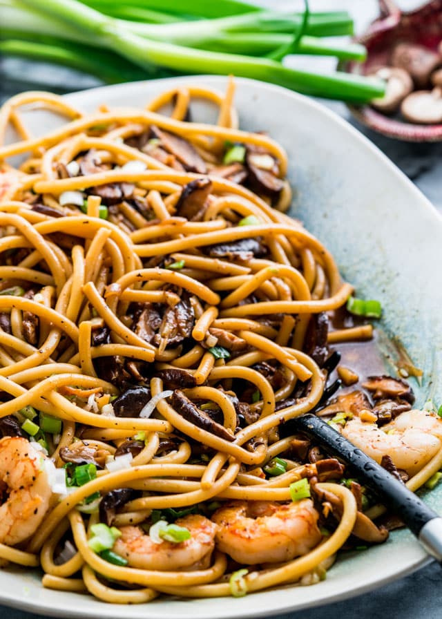 noodles with shiitake and shrimp sauce on a platter