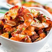 a bowl full of maple bbq glazed bacon wrapped shrimp
