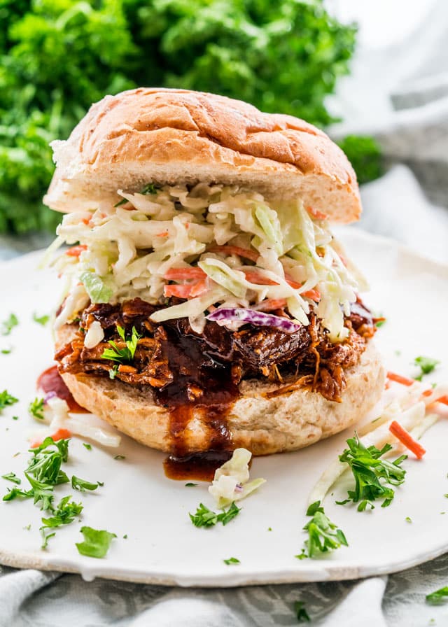 pulled pork sandwich on a white place made in an instant pot