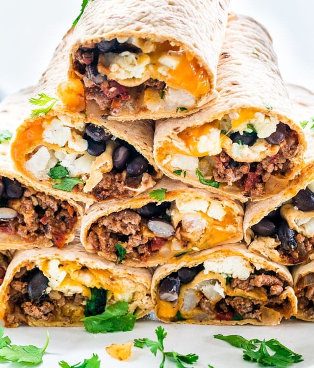 tex mex breakfast wraps stacked on a plate