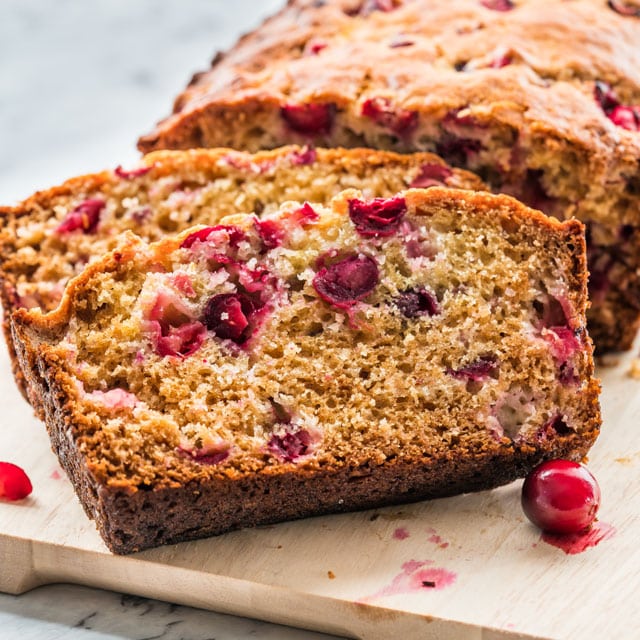 two slices of cranberry bread in front of the bread