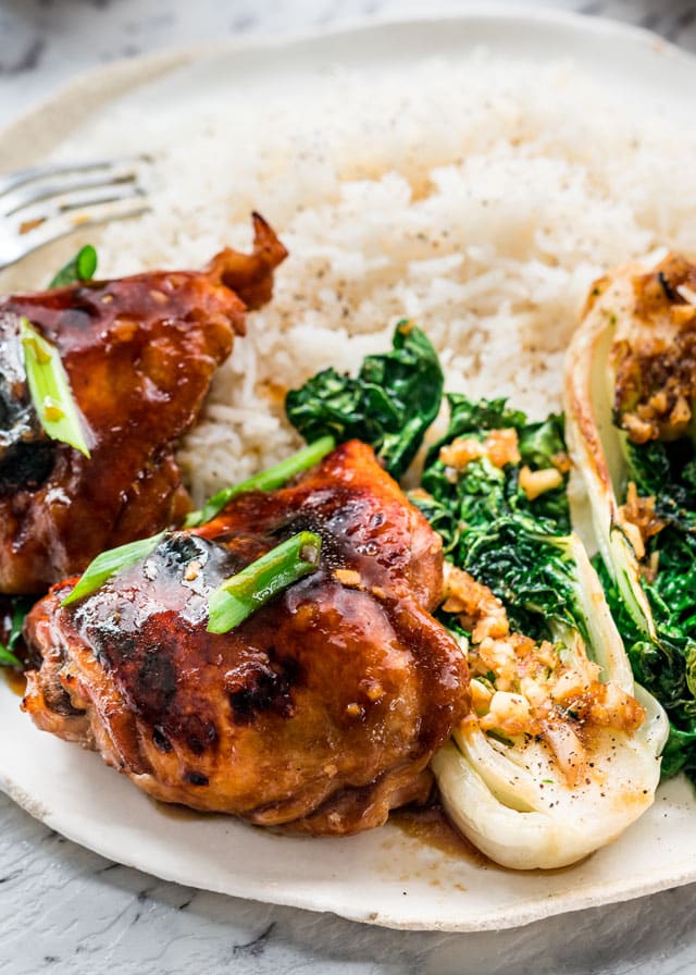 Instant teriyaki chicken with rice and bok choy in a white dish