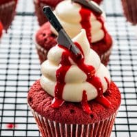 side view shot oh halloween red velvet cupcakes on a cooling rack