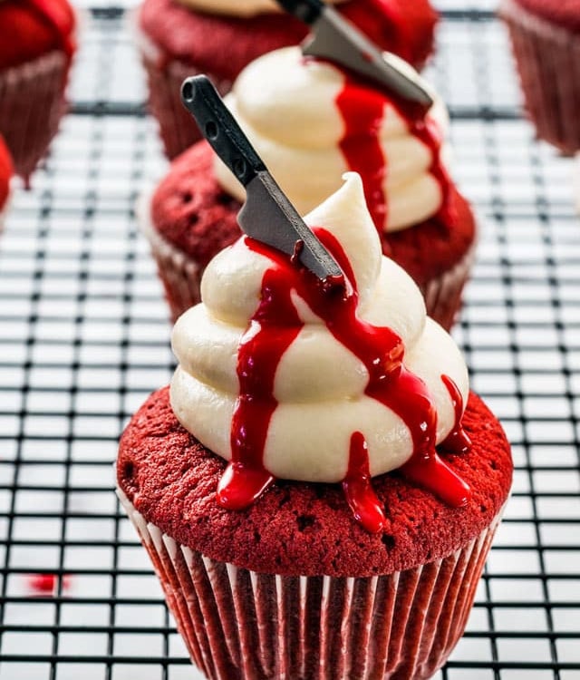 side view shot oh halloween red velvet cupcakes on a cooling rack