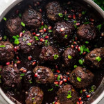 overhead shot of a pot of pomegranate cocktail meatballs