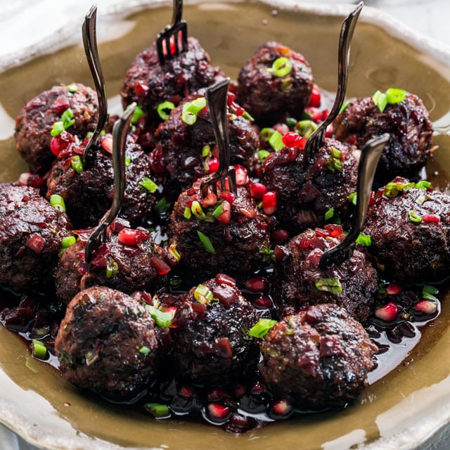 Platter of Pomegranate Cocktail Meatballs with mini forks