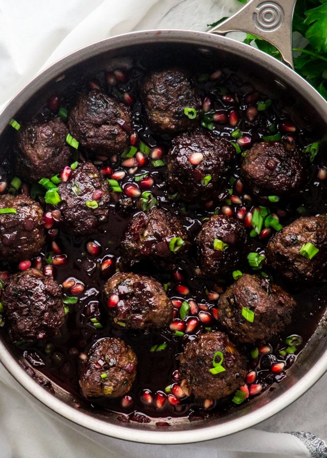 Overhead shot of Pomegranate Cocktail Meatballs in a pan