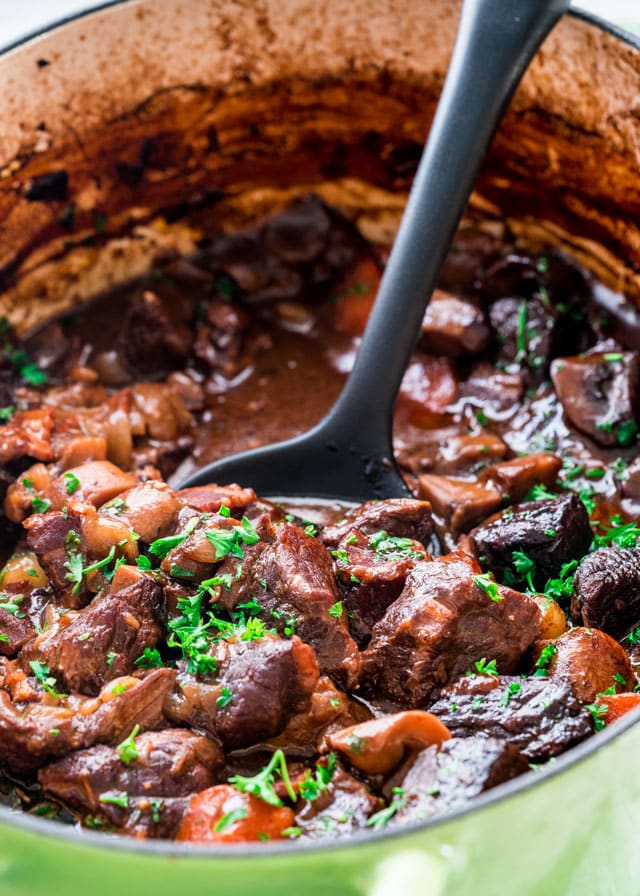 a bit pot of beef bourguignon with a spoon