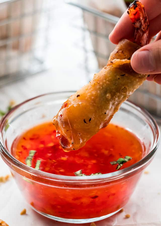dipping a Firecracker Shrimp in sweet chili lime sauce