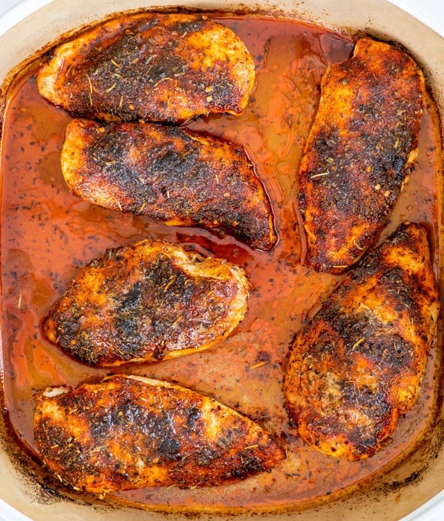 overhead shot of oven baked chicken breasts in a baking dish