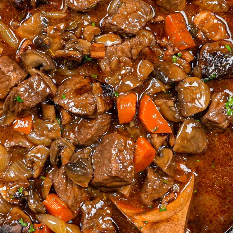 freshly made beef bourguignon in a large pot.