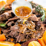 a spoon pouring gravy over the crock pot roast