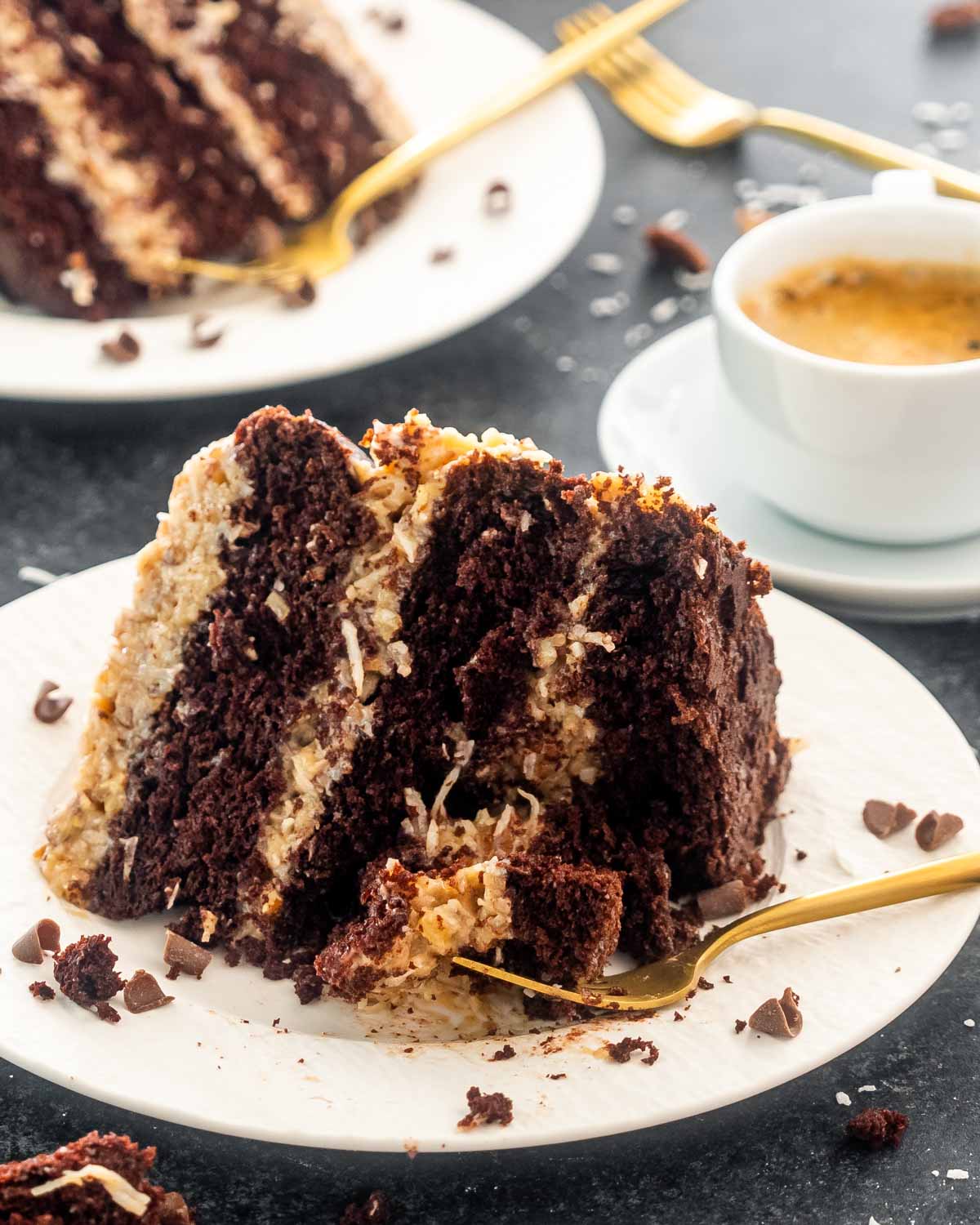 a slice of german chocolate cake slice on a white plate.