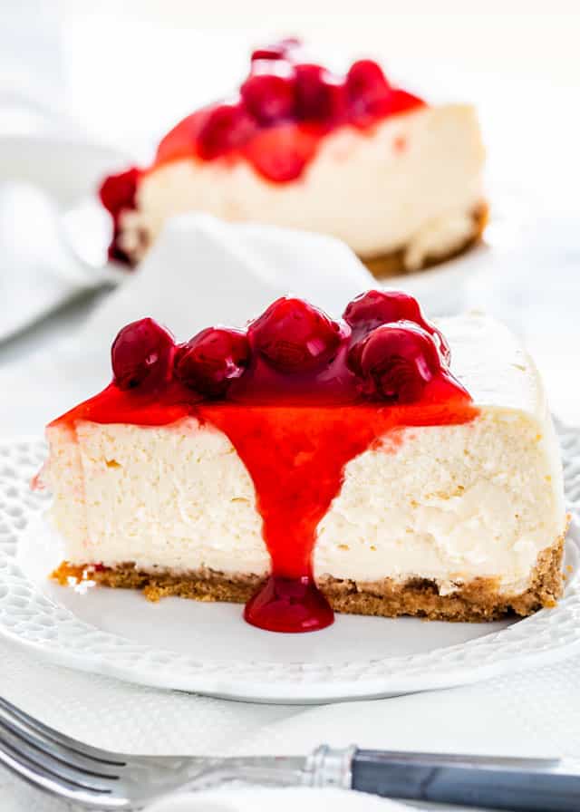 slice of cheesecake with cherry pie filling