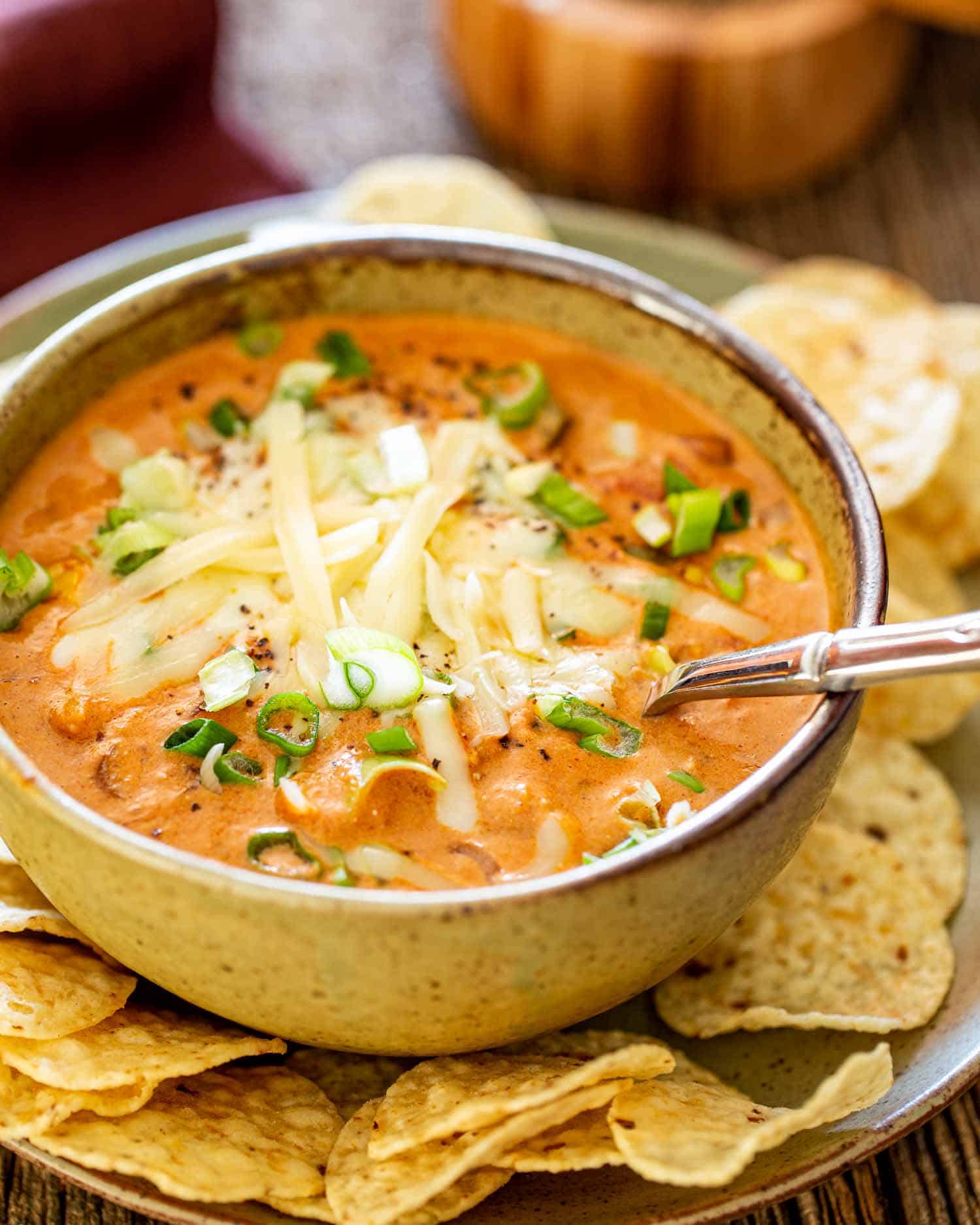 a bowl of cheesy chicken enchilada soup.