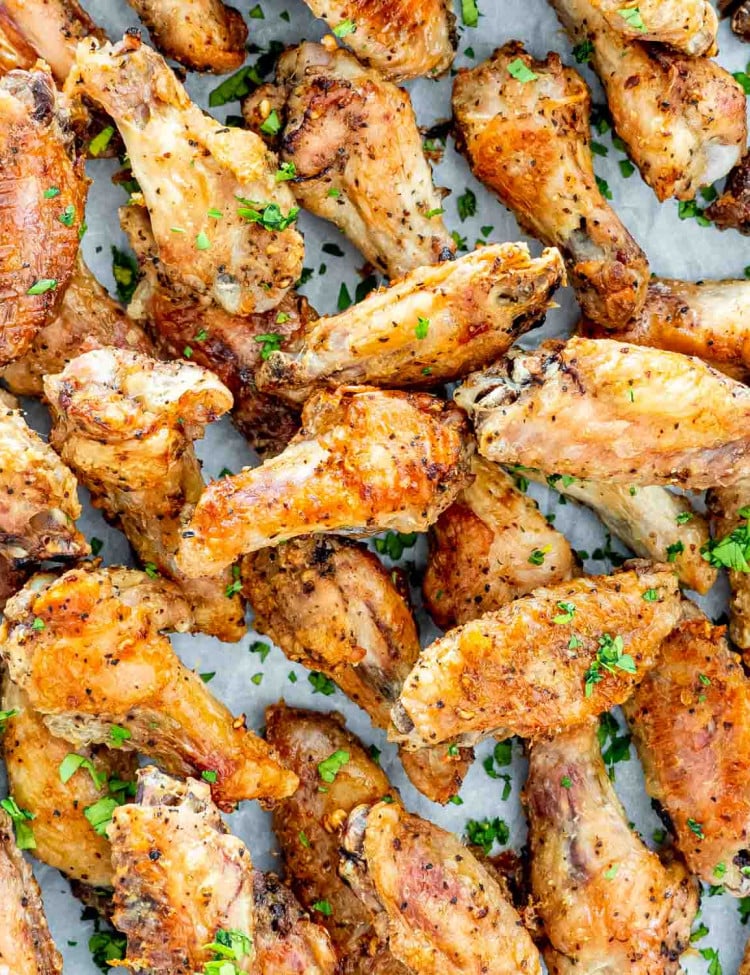 crispy baked salt and pepper wings garnished with parsley.