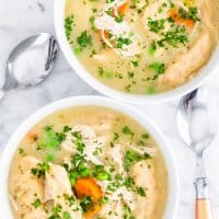 overhead shot of two bowls in instant pot chicken and dumplings