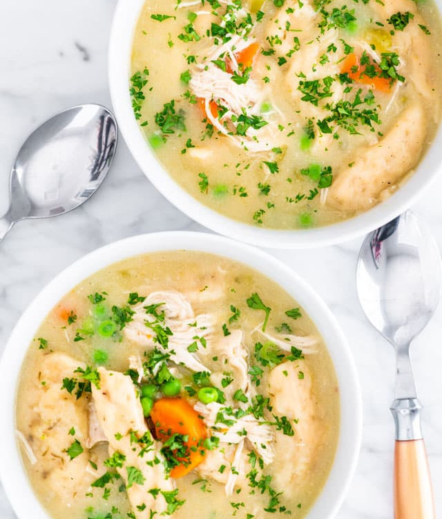 overhead shot of two bowls in instant pot chicken and dumplings