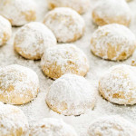 mexican wedding cookies on parchment paper.