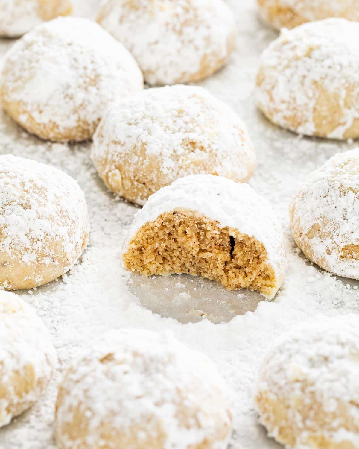 mexican wedding cookies on parchment paper.