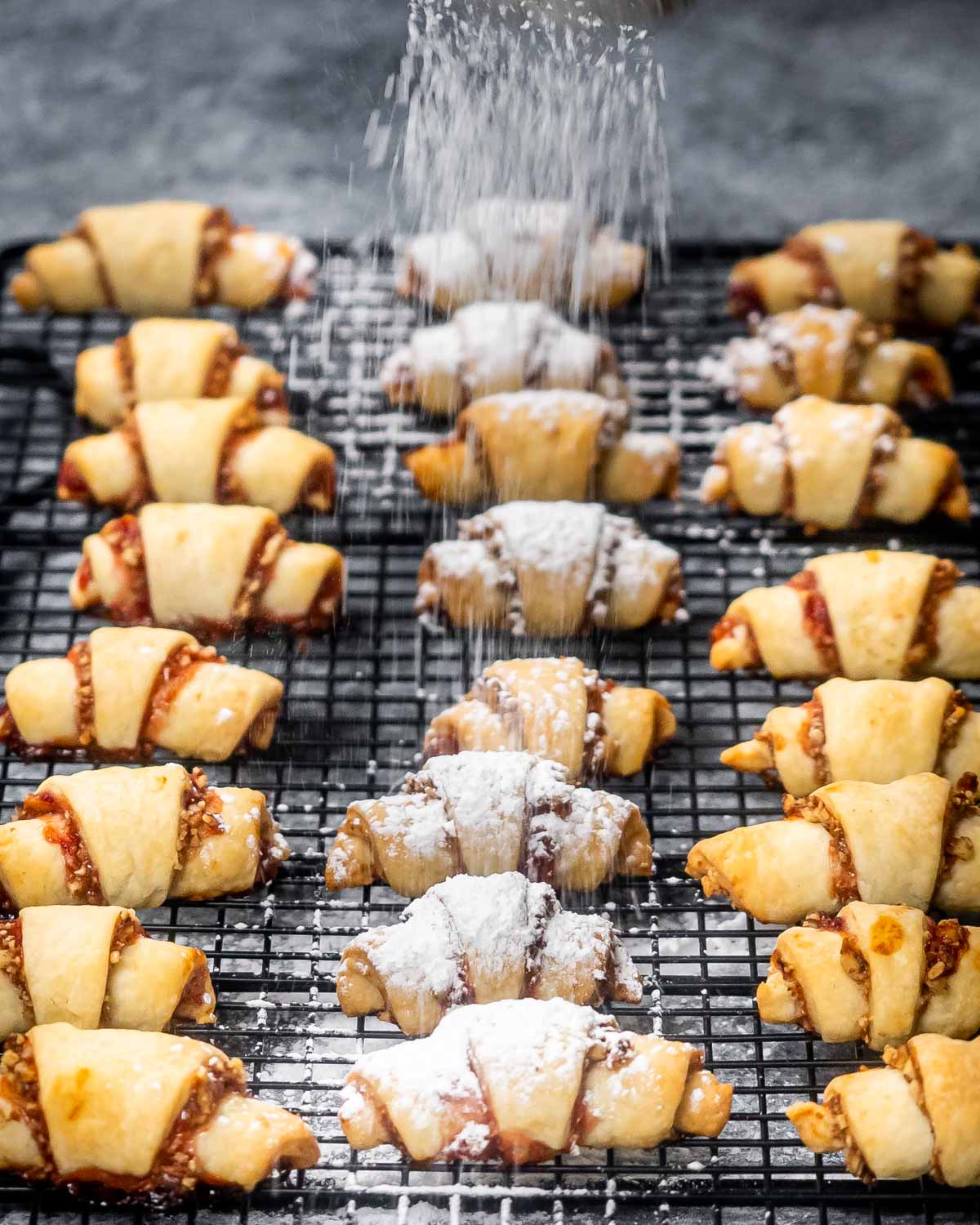 rugelach cookies on a cooling rack.