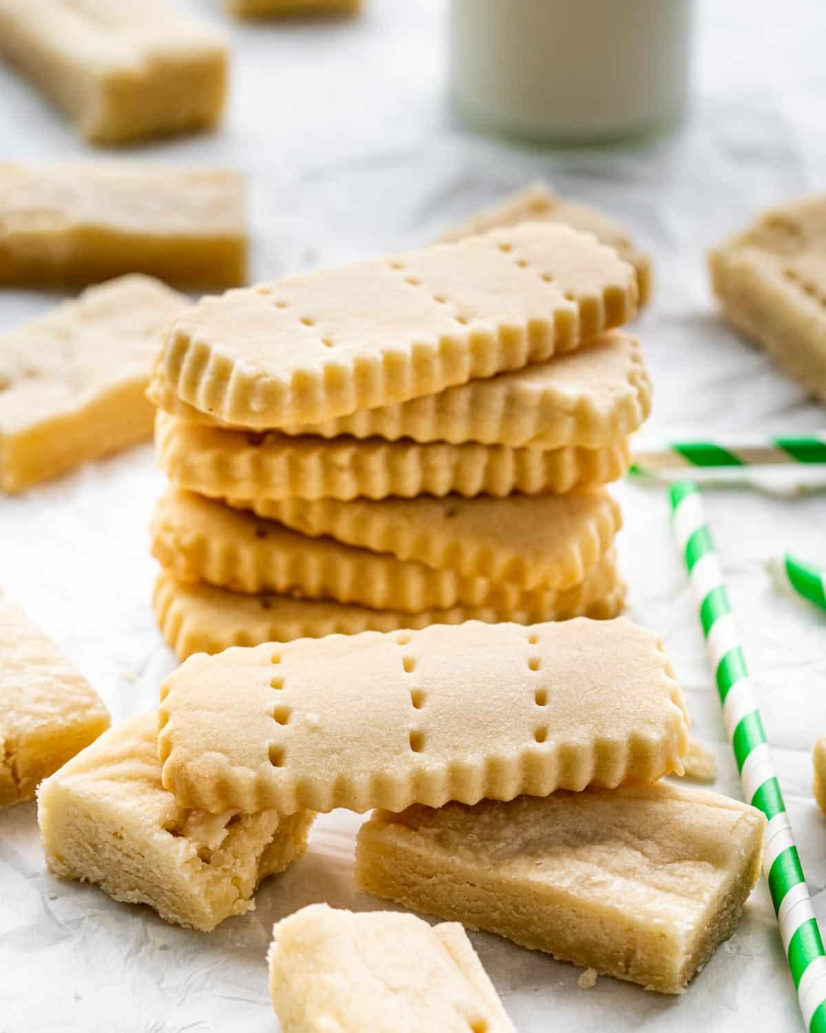 a stack of shortbread cookies on parchment paper.