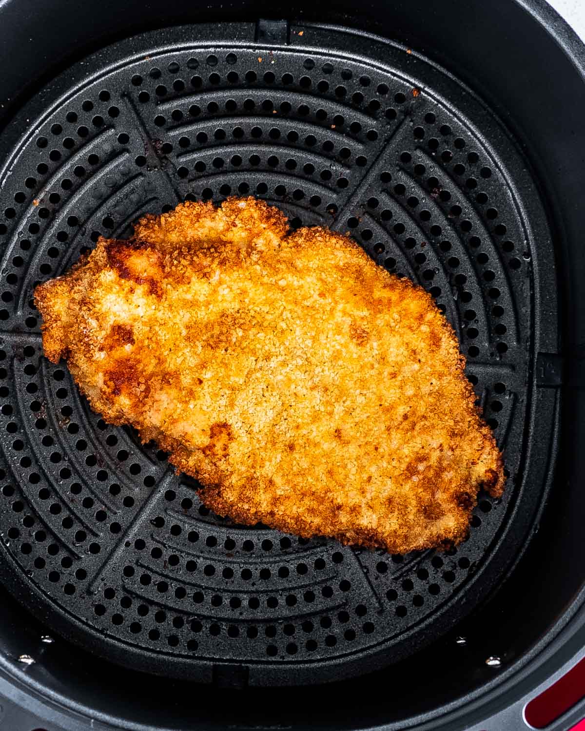 a chicken schnitzel in the air fryer.