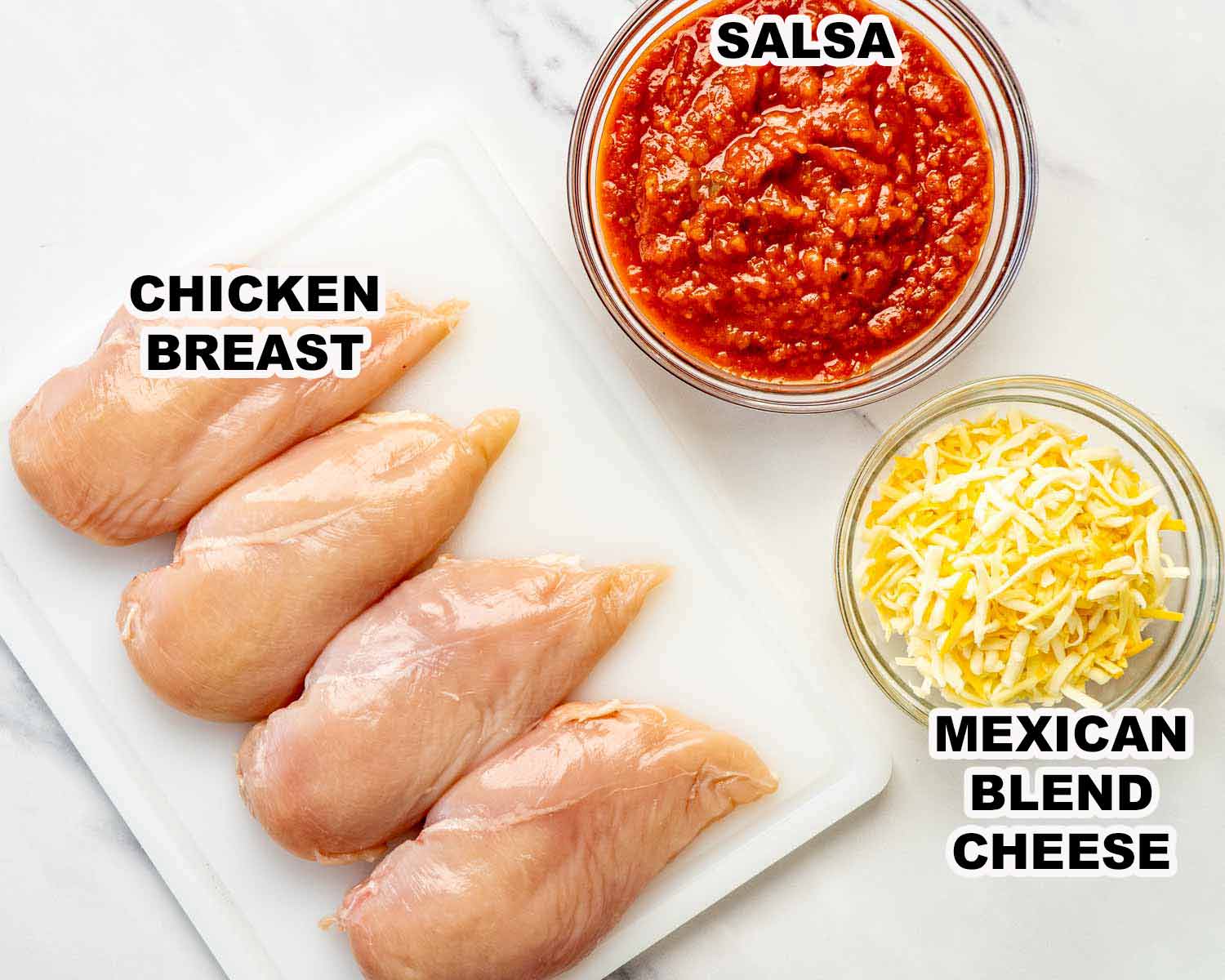Crockpot salsa chicken ingredients including chicken breasts, chunky salsa, and shredded Mexican blend cheese arranged and labeled for the recipe.