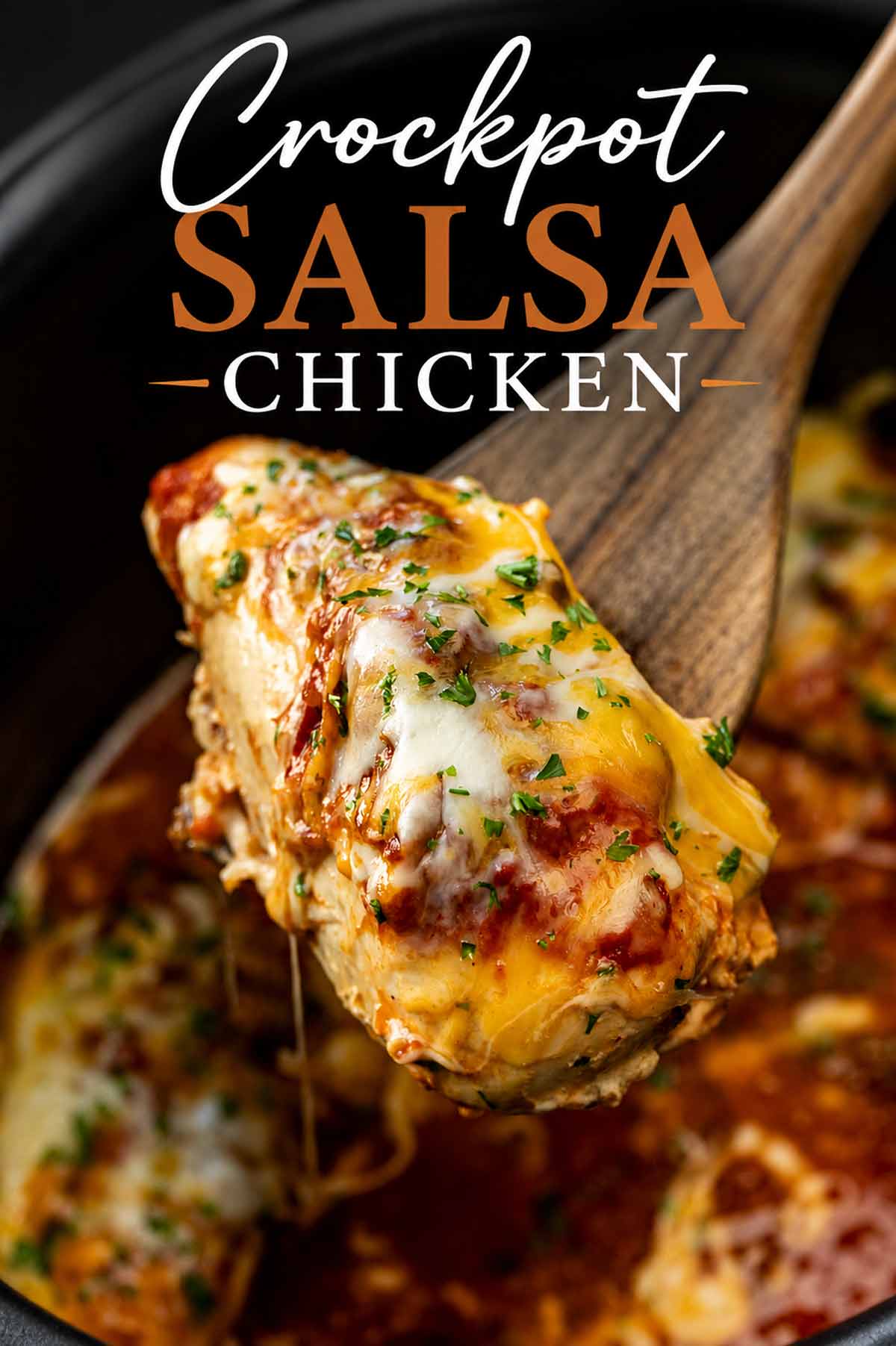 Pinterest image of cheesy crockpot salsa chicken lifted from the slow cooker with Crockpot Salsa Chicken recipe title above.