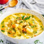 mulligatawny soup in a bowl garnished with parsley.