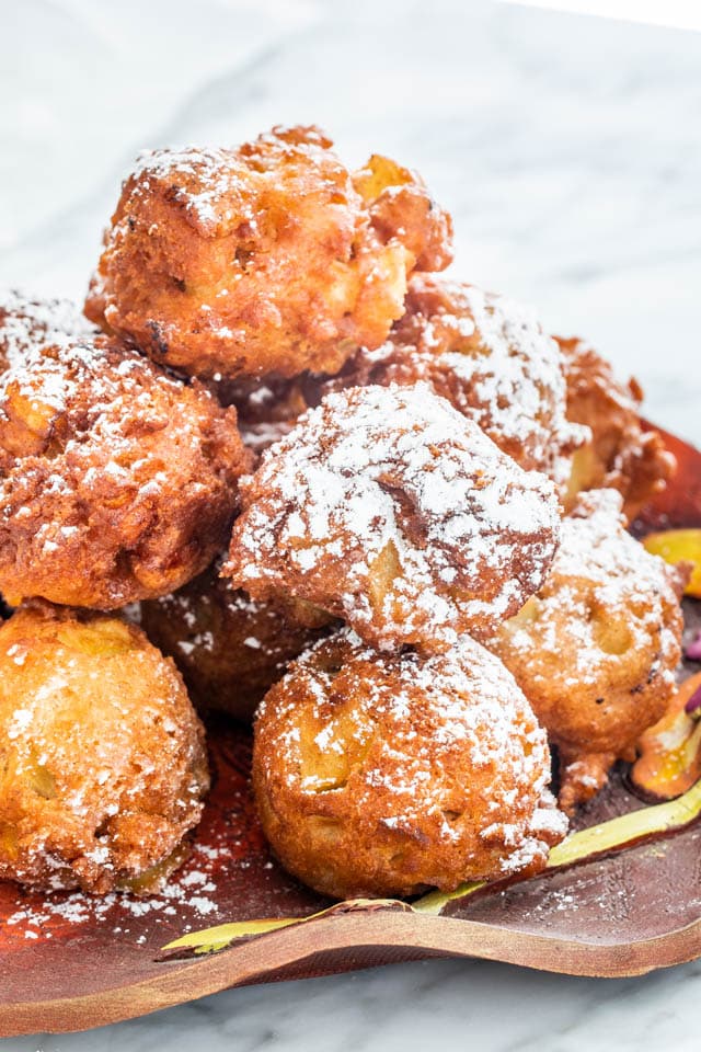 apple fritters on a red plate