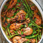 freshly made coq au vin in a dutch oven.