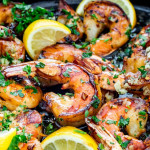 side view shot of honey garlic shrimp in a skillet