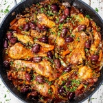 freshly made chicken cacciatore in a blue pot.
