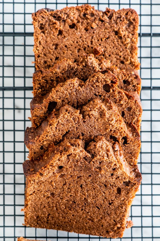 overhead shot of chocolate pound cake sliced on a cooling rack