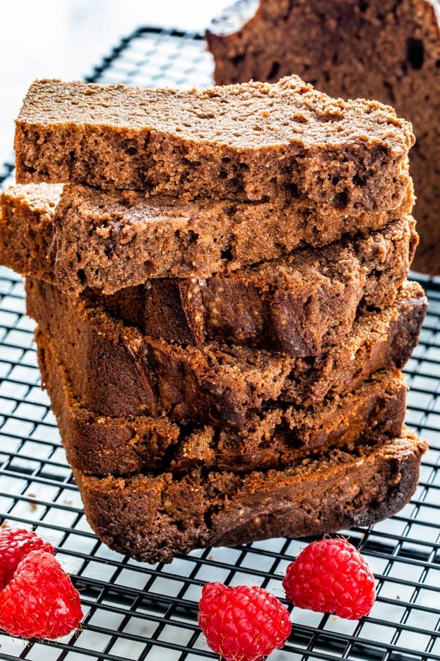 Chocolate Pound Cake slices stacked on top of each other on a cooling rack