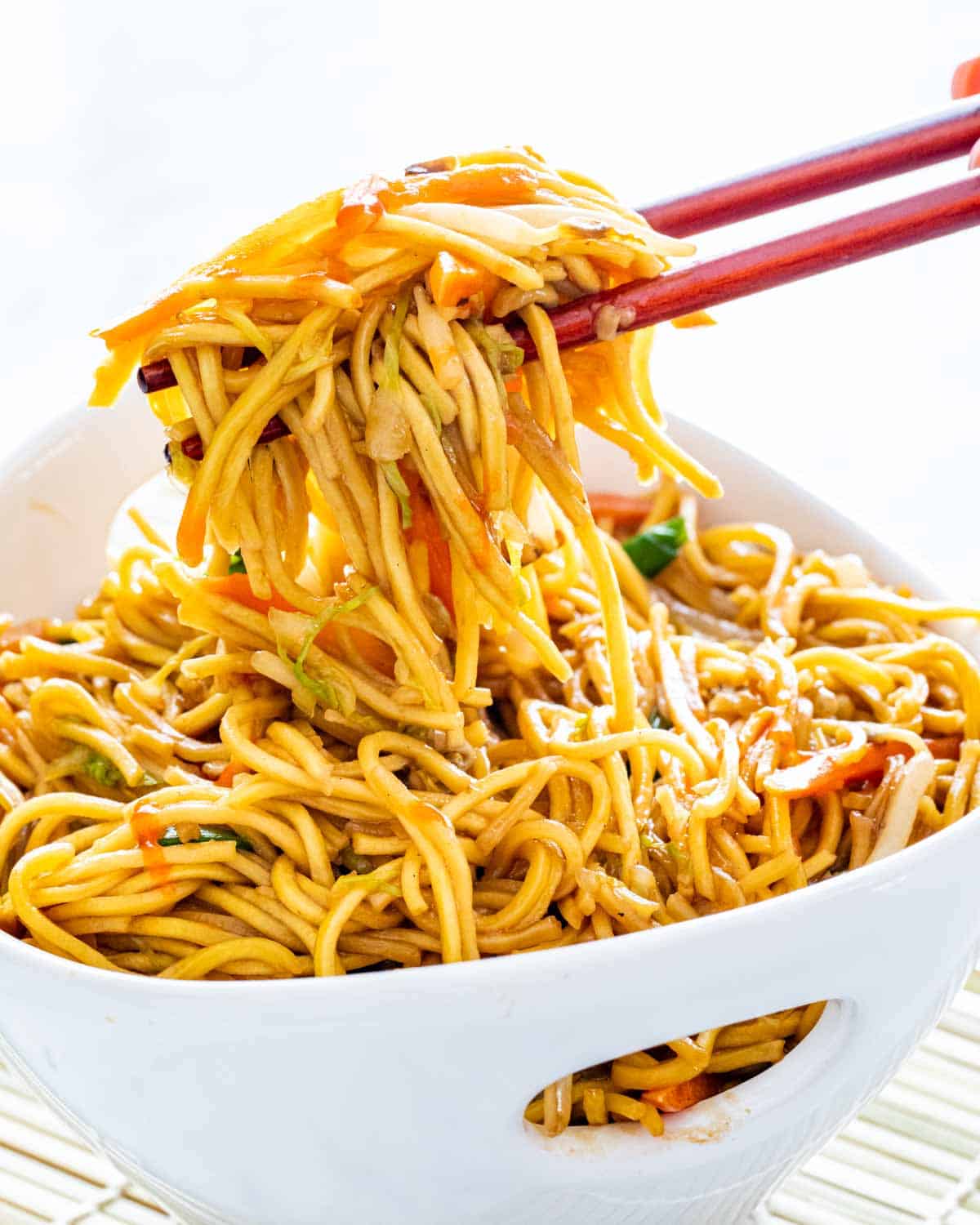 chow mein in a white asian bowl.
