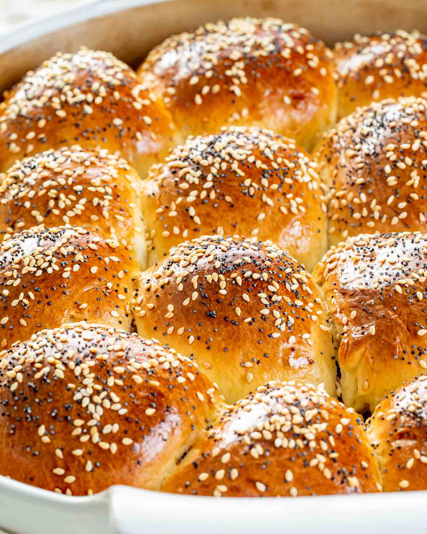 freshly baked dinner rolls in a baking dish.