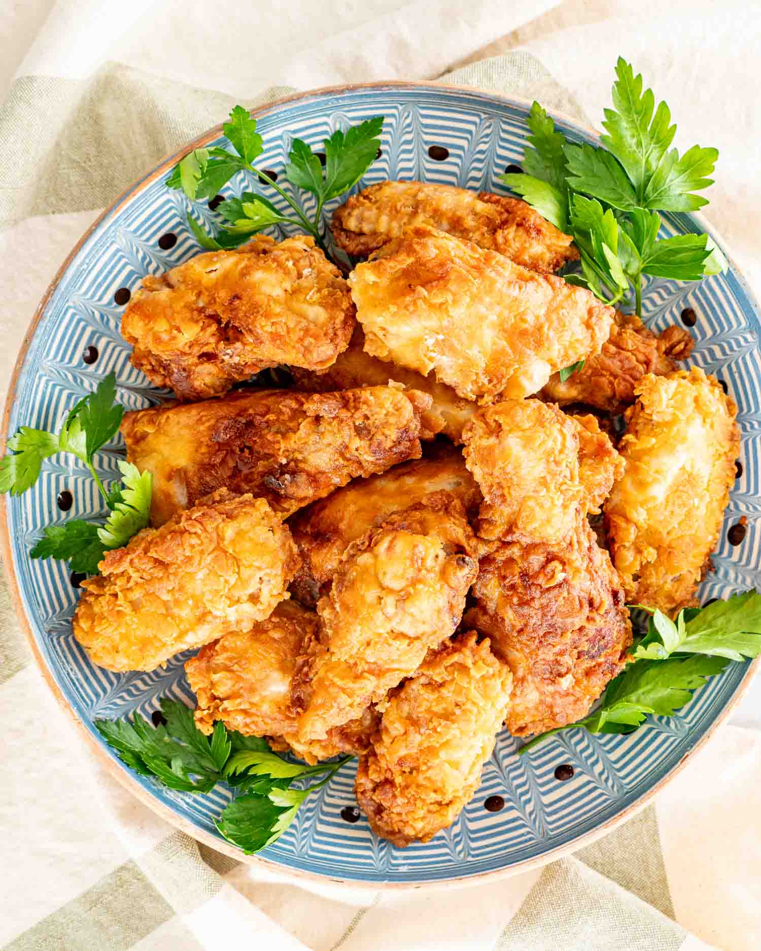 a bowl with crispy and delicious buttermilk fried chicken.