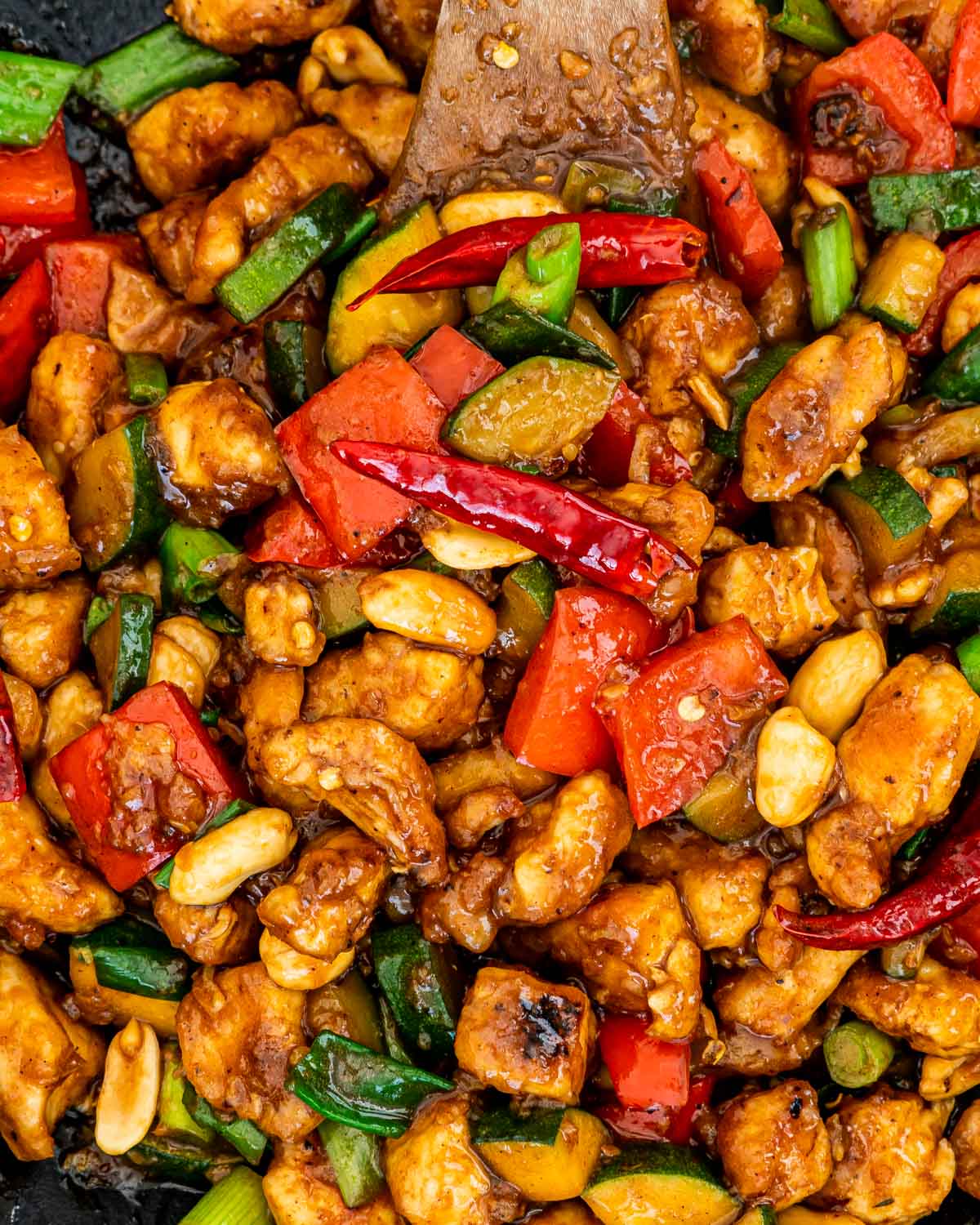 closeup of kung pao chicken in a wok.