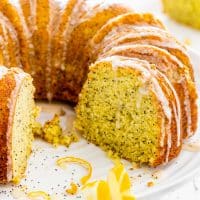 lemon poppy seed cake on a cake platter.