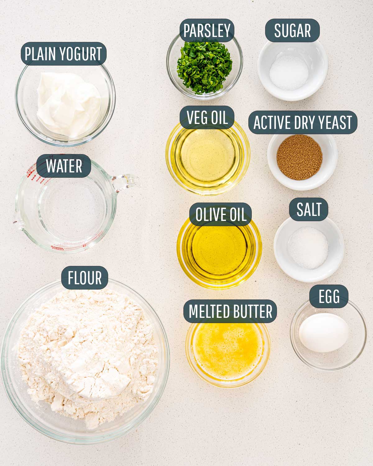 overhead shot of all the ingredients needed to make naan bread.