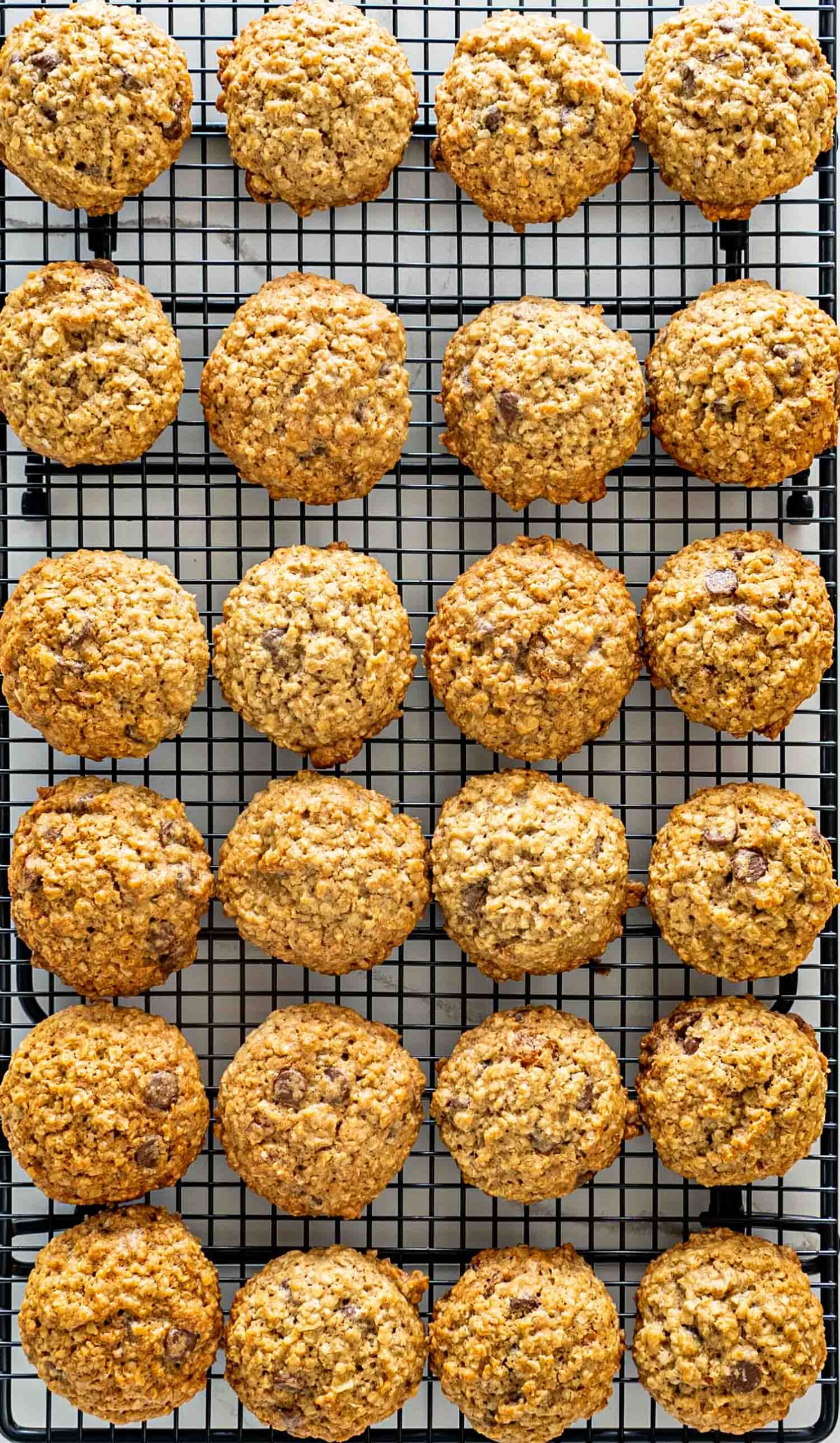 oatmeal cookies cooling on a wire rack.