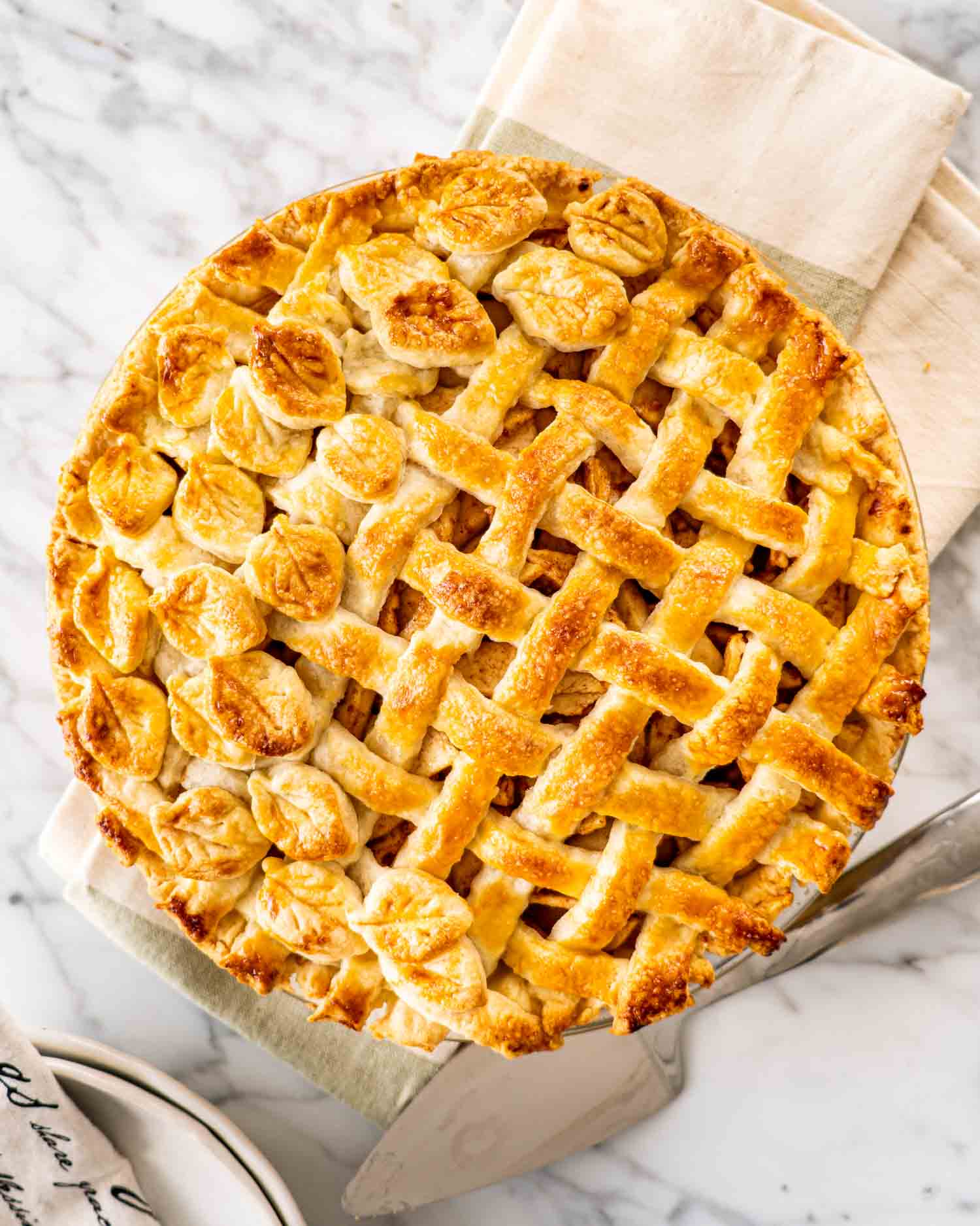 a freshly baked apple pie with lattice top crust.