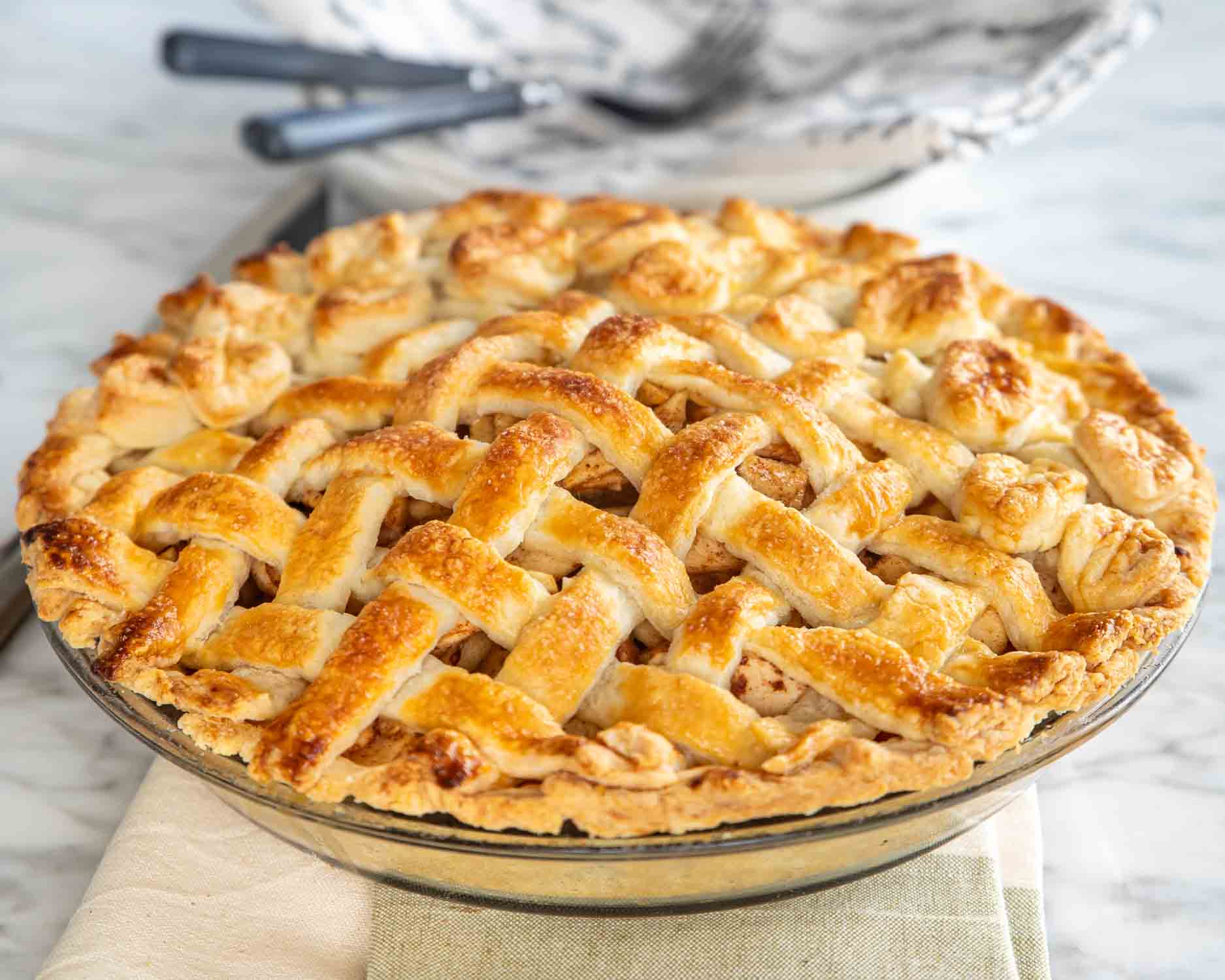 freshly baked apple pie in a pie dish.