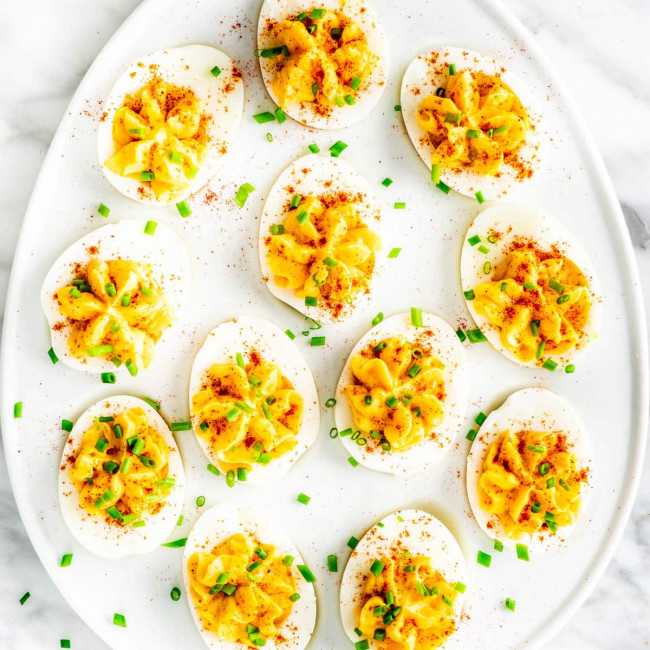 overhead shot of an egg shaped plate covered in deviled eggs