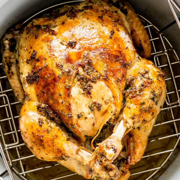 overhead shot of a whole chicken in a pressure cooker